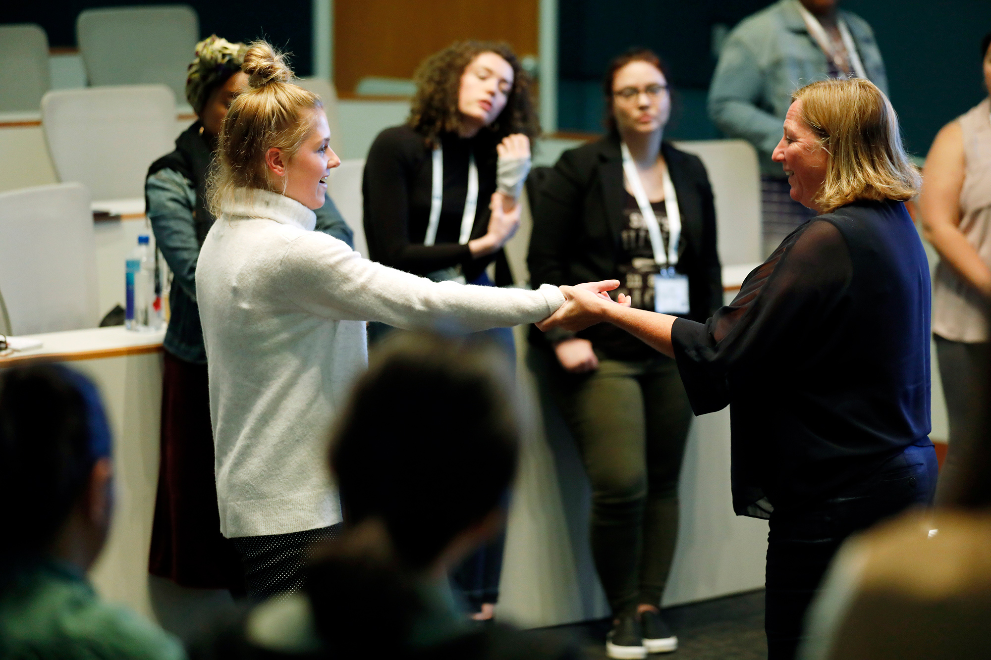 Cath Mossom, right, demonstrates an evasive maneuver with Amanda Wachter, left, during the self-defense HEAT training session at the Women in Journalism Workshop in the Reynolds Journalism Institute Saturday May 4, 2019 in Columbia, Missouri.