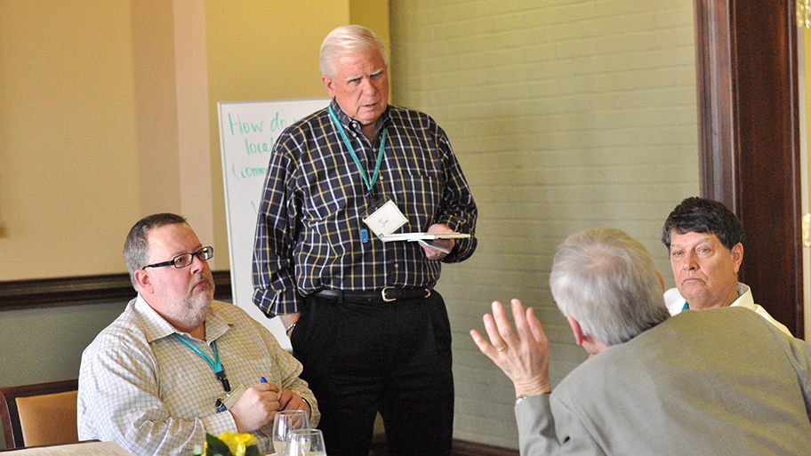 Scott Charton, left, and Jim Sterling, standing, participate in a Talk Story, Write Story brainstorming session in Columbia, Missouri, this past spring. Charton is the owner of Charton Communications & Consulting LLC and former director of communications for the University of Missouri System. Sterling holds the Missouri Chair in Community Newspaper Management at the University of Missouri School of Journalism.