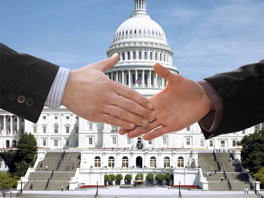 Shaking hands in front of the Capitol