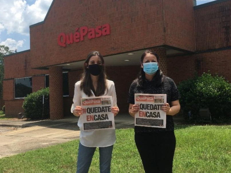 Karina Neyra and journalist Andrea Forcada in front of Que Pasa in North Carolina educating the community. Photo by Eloy Tupayachi