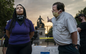 Anais, 26, who wants to remove the Emancipation statue in Lincoln Park in Washington, DC, argues with a man who argues to keep it, June 25th, 2020. Critics say the Emancipation Memorial — which shows Lincoln holding a copy of the Emancipation Proclamation as an African American man in a loincloth kneels at his feet — is demeaning in its depiction of African Americans. The drive to remove the statue comes amid a wave of calls to take down monuments of Confederate generals.
