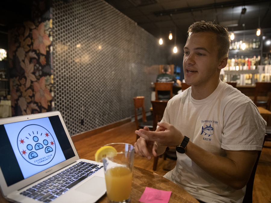 University of Missouri journalism student Trent Tarantino shows the logo he made for Erin Hooley’s RJI fellowship project, “Covering Your Community,” Wednesday, Aug. 25, 2021, at the Tiger Hotel in Columbia, Missouri. Photo: Erin Hooley