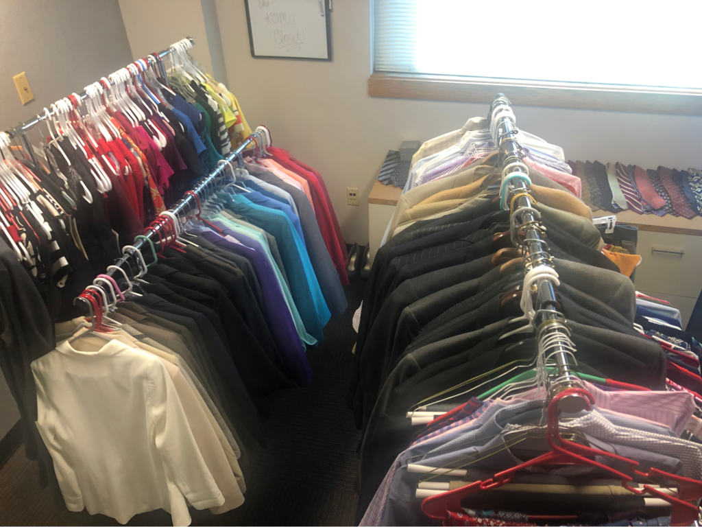 Rows of donated polo shirts, suit jackets, suit pants, ties, dresses and other camera ready attire are hung up in KOMU's loaner closet. Photo courtesy of Kellie Stanfield.