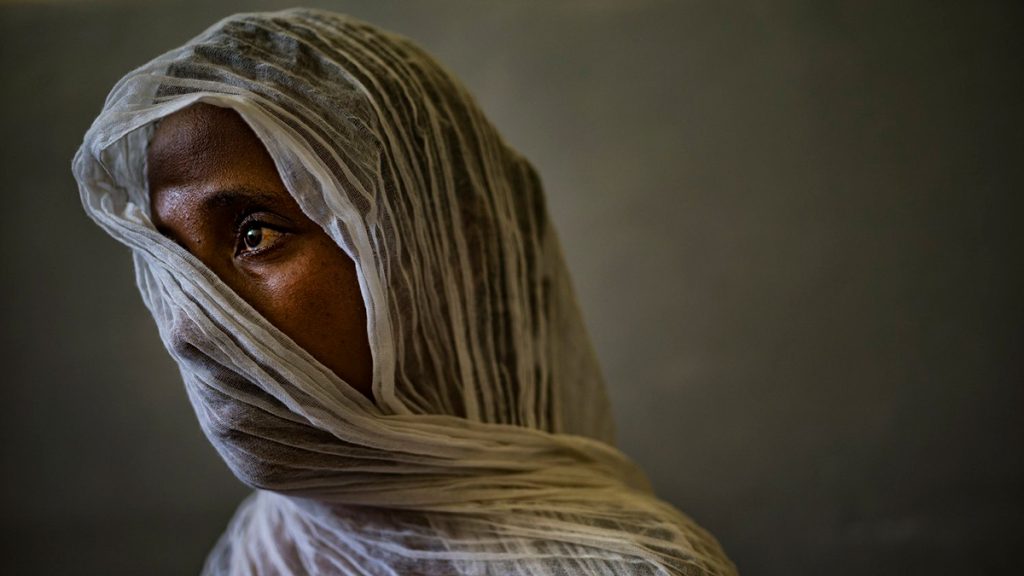 Eyerus, 40, poses for a portrait in a safe space for victims of sexual assault in the Ayder Hospital in Mekele, Tigray, Ethiopia, May 2021. Photo: Lynsey Addario