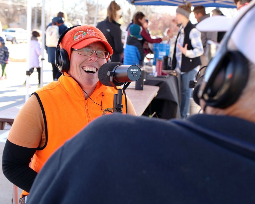 A Missouri On Mic participant talks with the production team at the Columbia Farmers Market, April 9, 2022.
