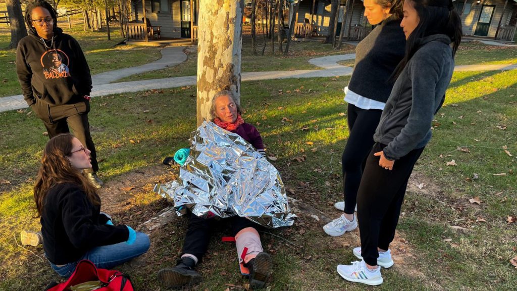 IWMF Next Gen Safety Trainer Fellows review first aid skills in a demonstration exercise during the fellowship's Dec. 2021 retreat in Virginia. Photo: Tara Pixley