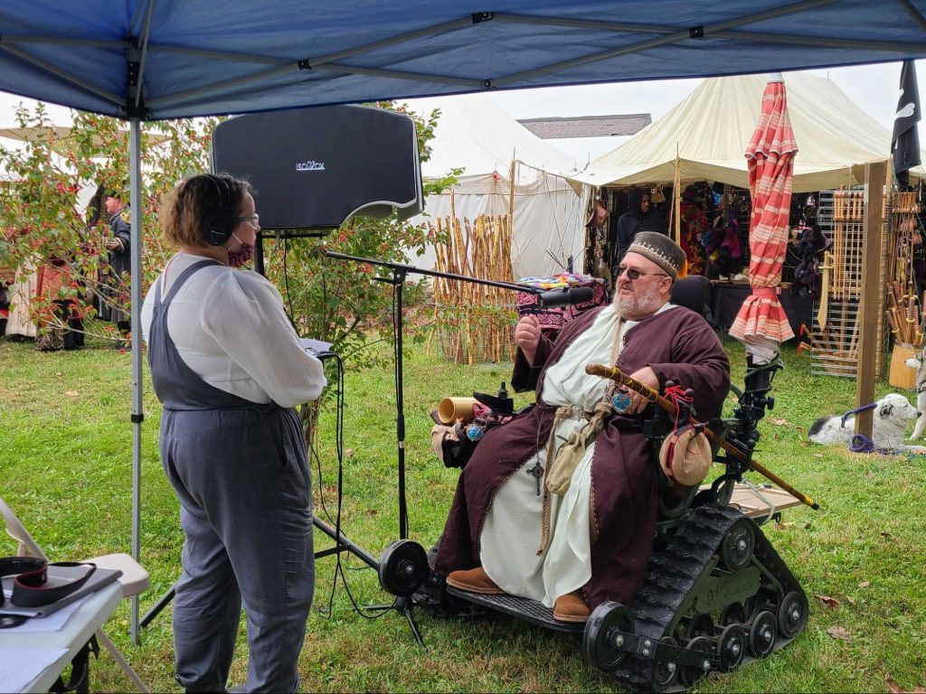 Senior Abigail Ruhman, left, interviews David Wiseman at the Central Missouri Renaissance Festival in October 2021. Photo: Becky Smith