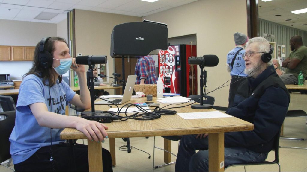 Producer Alice Wiche, left, interviews Lester Bennett, right, at Paquin Towers in March 2022. Photo: Beibei Liu