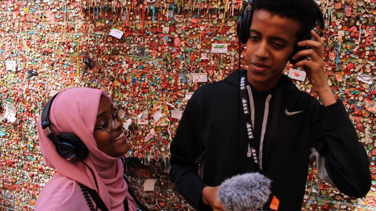 RadioActive Youth Media youth reporters Zeytun and Abay prepare to interview people in front of Seattle’s iconic gum wall. Photo: RadioActive/KUOW