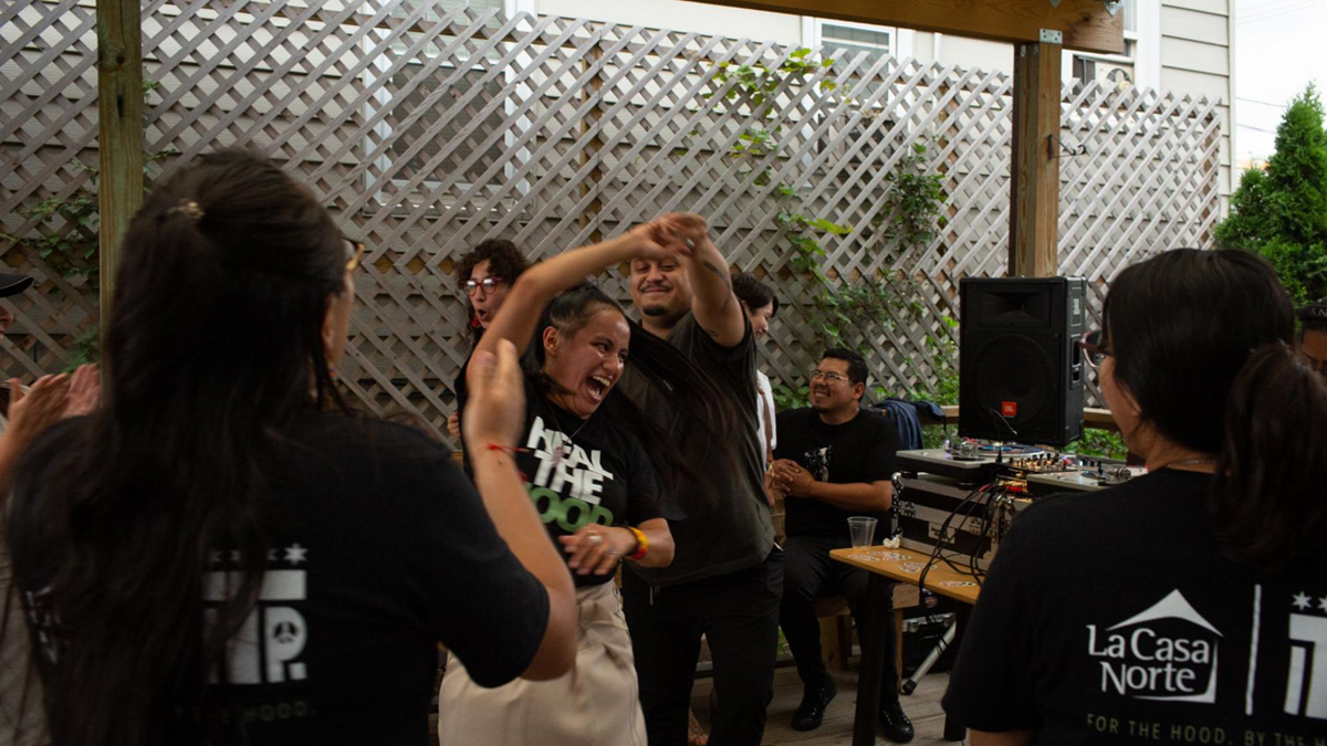 Community members, sources, and artists dance at a zine launch party hosted by Borderless Magazine and CatchLight Local on the South Side of Chicago in 2021. Photo: Michelle Kanaar | Borderless Magazine