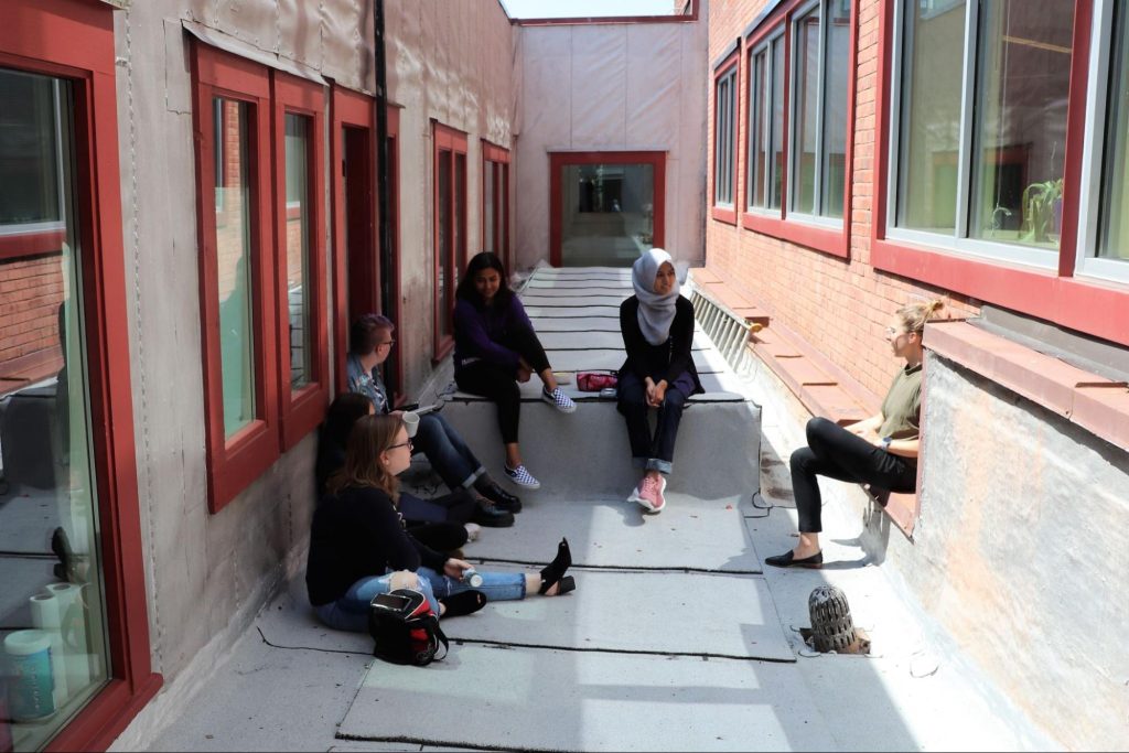 RadioActive youth producers and staff hang out on the roof with KUOW reporter Paige Browning. Photo: Kelsey Tolchin-Kupferer