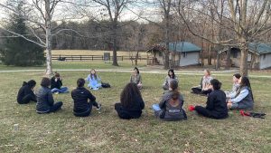 The International Women’s Media Foundation NextGen Fellows cohort perform grounding exercises after completing a first aid scenario at the December 2021 Virginia fellows retreat and training. Photo: Tara Pixley