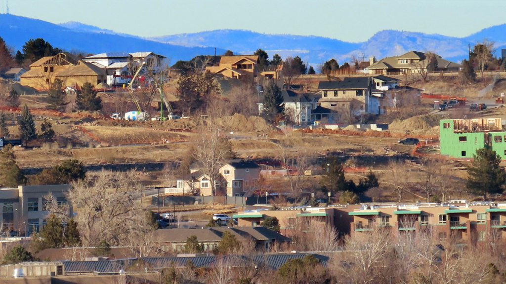 Homes destroyed by the 2021 Marshall Fire can be seen being rebuilt in the burn area near Boulder, Colorado. Photo: Don Kohlbauer | Boulder Reporting Lab