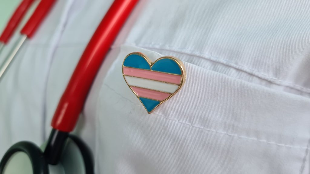 Transgender LGBT symbol stethoscope with rainbow icon for rights and gender equality. Medical care insurance and doctor