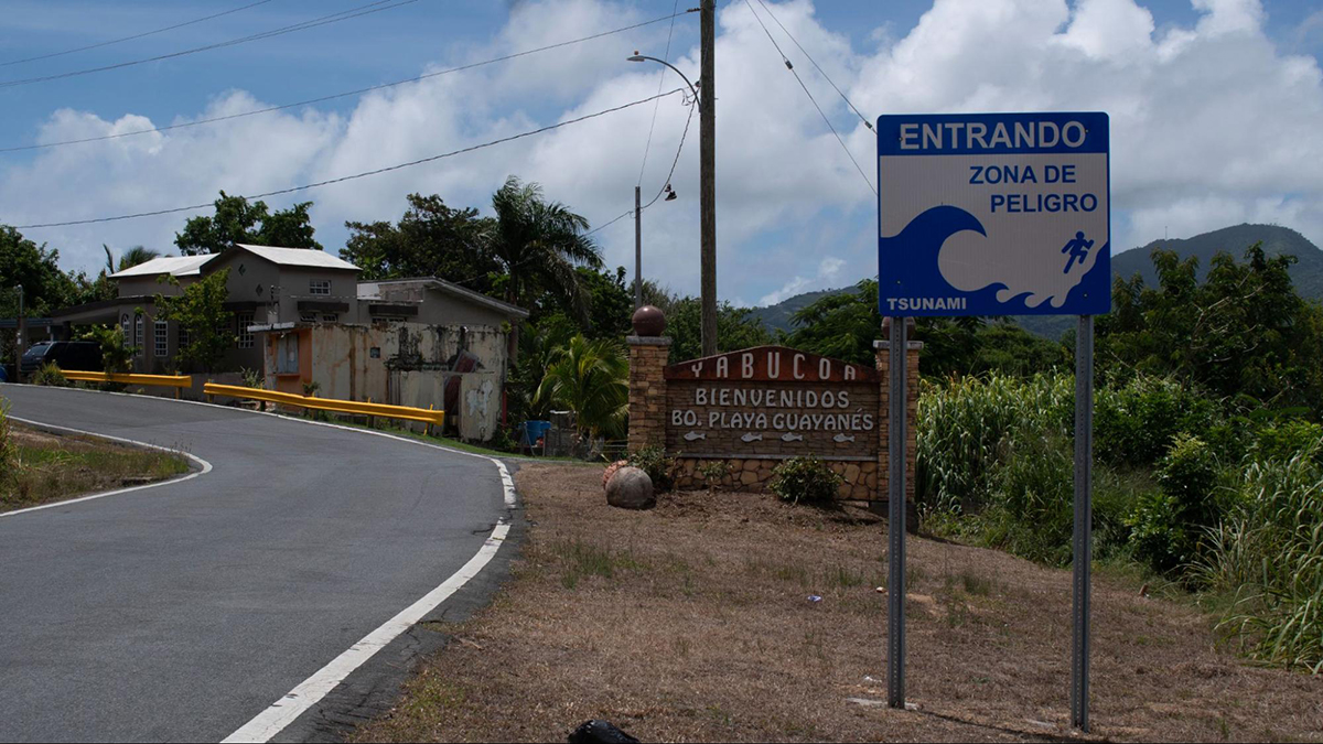 “Entering Danger Zone,” reads in Spanish the sign at the entrance of Yabucoa municipality, where Hurricane Maria made landfall in 2017 in Puerto Rico.