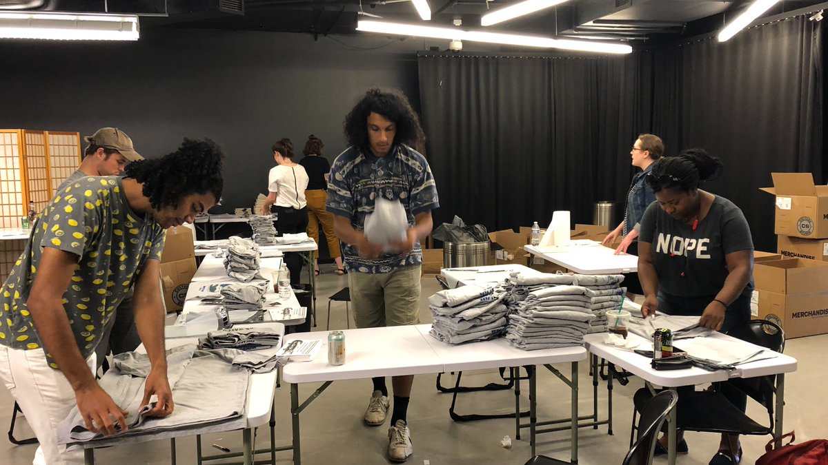 Block Club Chicago staff pack T-shirts during the sale of their first Gator Watch shirts in 2019.