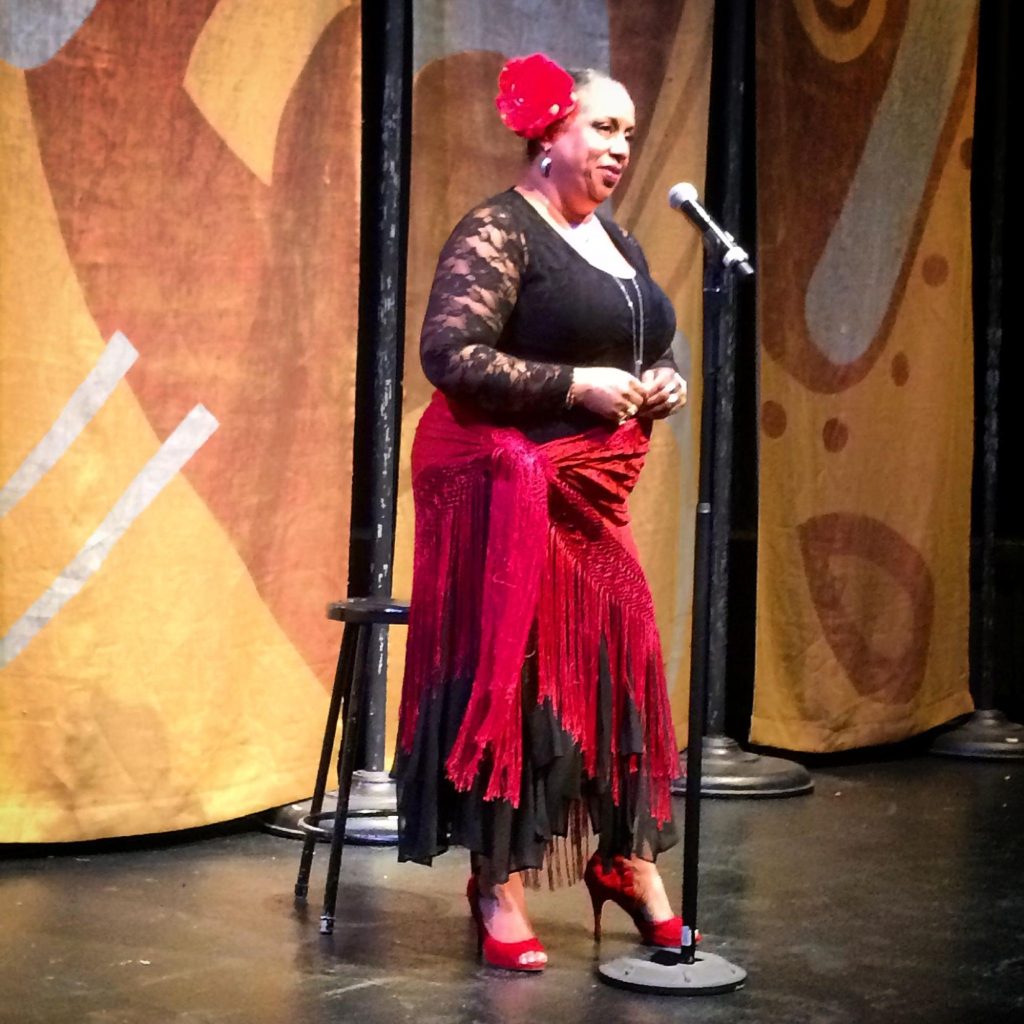 Professor Marilyn Omifunke Torres shares a true, personal story on stage at South Mountain Community College as part of the Arizona Storytellers Project put on by The Arizona Republic in Phoenix, in 2017. Photo: Megan Finnerty