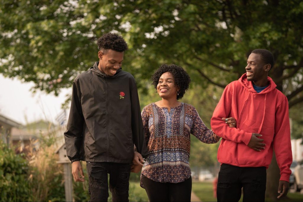 Agnes Kanjinga with her sons George Mutombo and Daniel Tshimanga outside their home on May 19, 2023, in Skokie, Ill. Photo by Martine Severin, a member of Diversify Photo. 