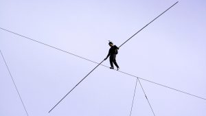 Man walking on high wire