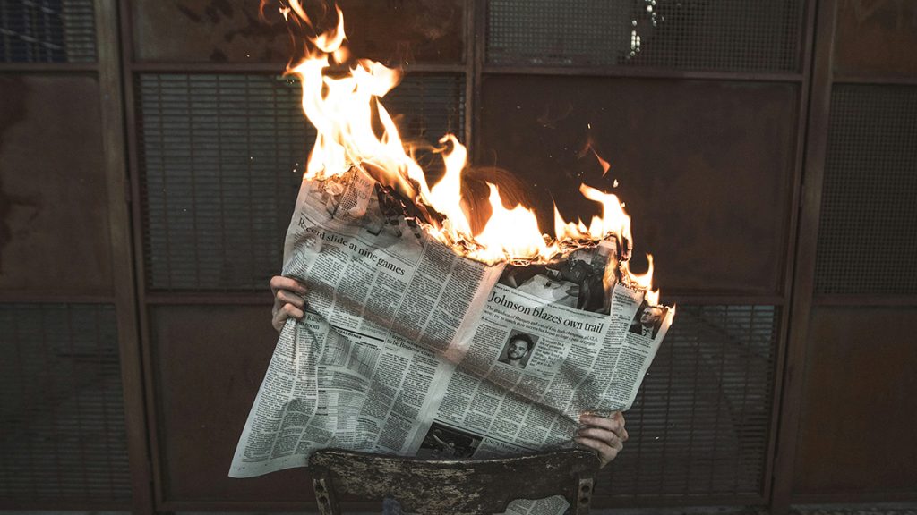 Newspaper on fire