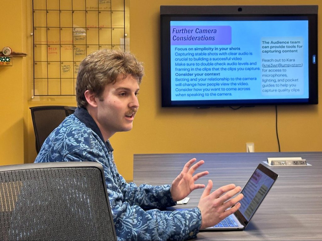 Owen Newland presents a training on vertical video using printed cheat sheets to beat reporters at The Missouri News Network. Photo: Nate Brown