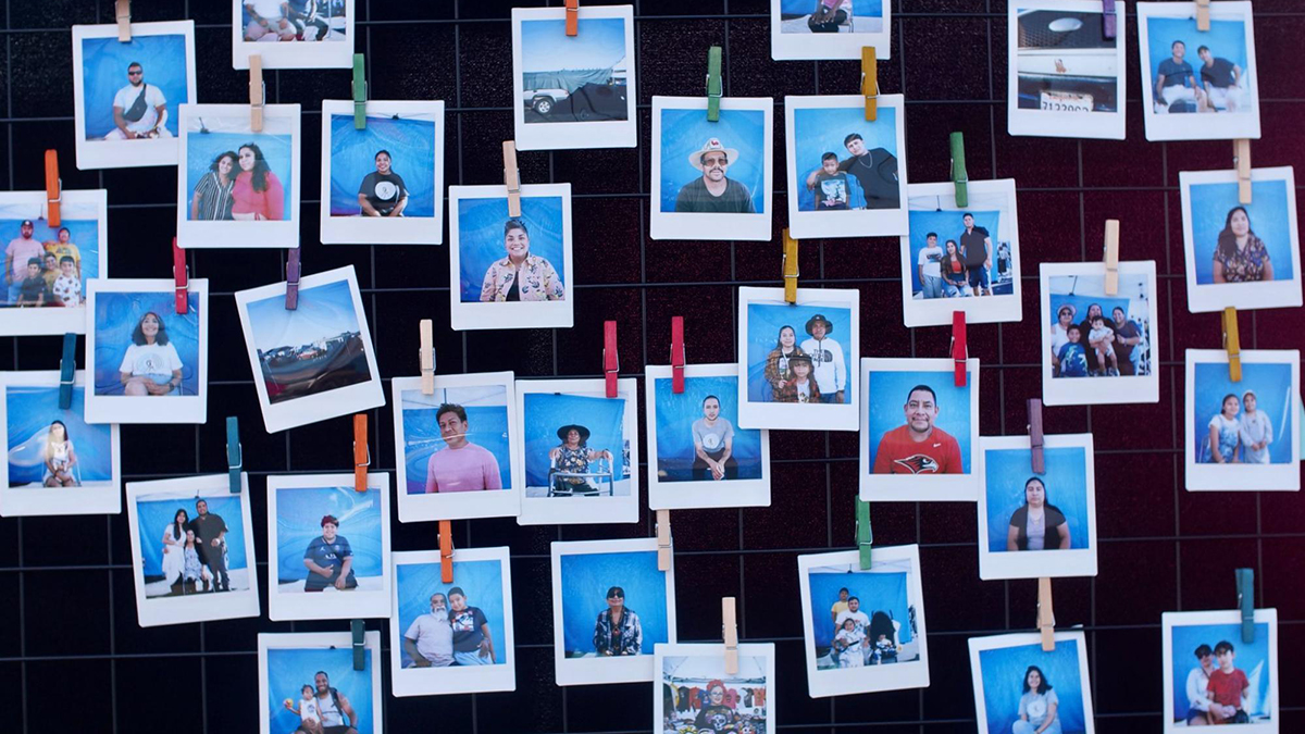 Instax photos of La Pulga storytelling booth participants made by photojournalist Hiram Alejandro Durán hang at the El Tímpano booth at the flea market in Oakland, Calif. Photo: Katherine Nagasawa | El Tímpano