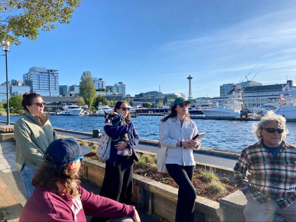 Participants in a Future Tides’ walking tour gather near Lake Union in Seattle