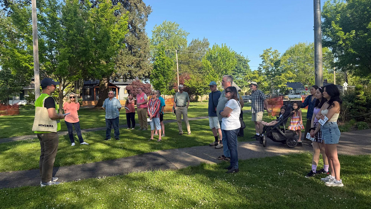 Group of people gathered in a park for a walking tour