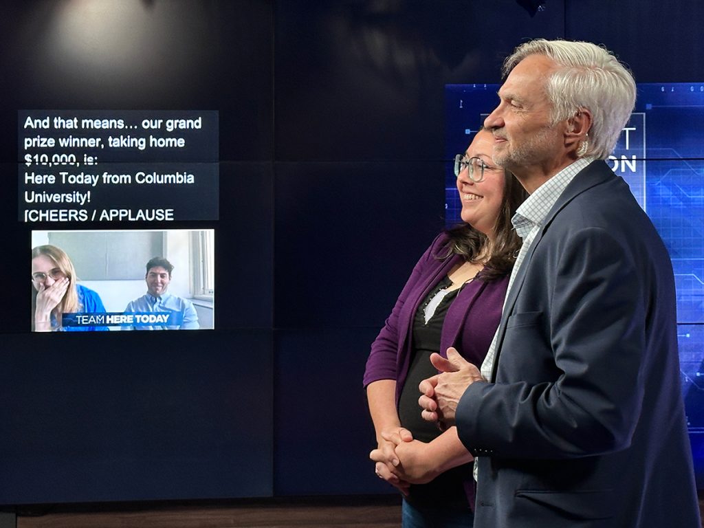 Kat Duncan [L] and Randy Picht {R] announce the grand prize winner for the 2025 RJI Student Competition — Team Here Today from Columbia University.