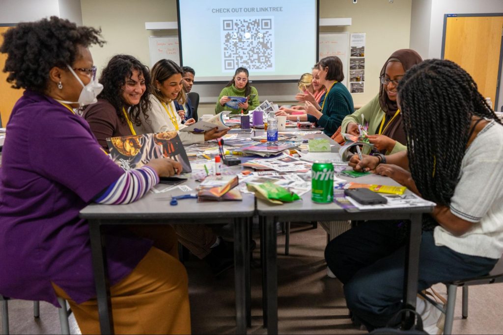 A table of women producing zines at The Green Line