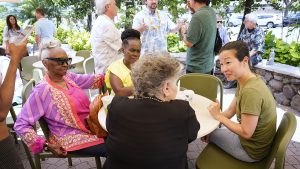 Honolulu Civil Beat director of philanthropy Mariko Chang, from right, meets with subscribers, supporters and readers on Thursday, July 20, 2023, at the Honolulu Coffee Experience Center in Honolulu. (Kevin Fujii/Civil Beat/2023)