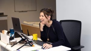 Sarah Alvarez at her desk at Outlier Media.