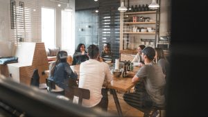 People gathered around a table talking