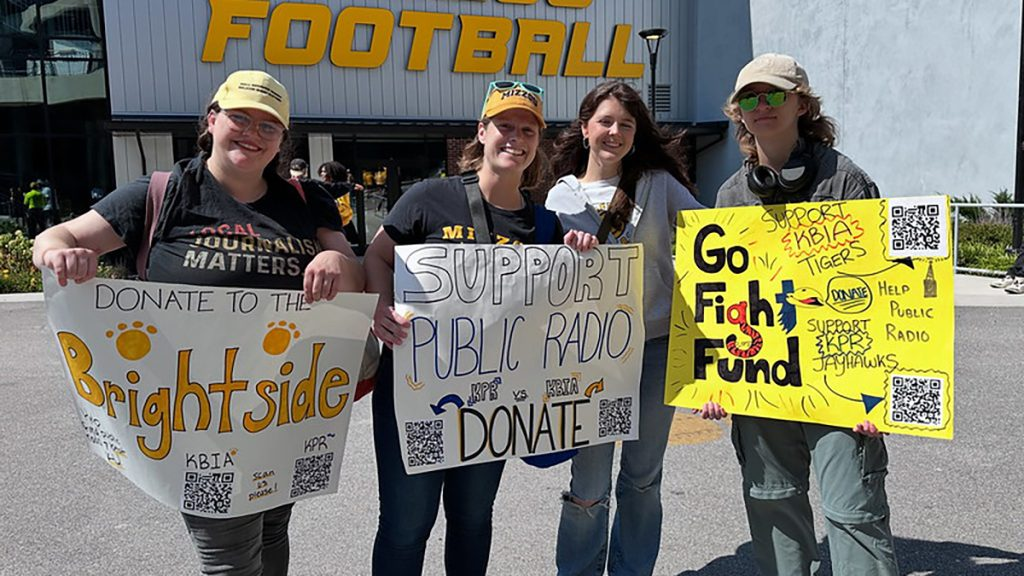 KBIA’s Rebecca Smith, Innovation in Focus Editor Emily Lytle, and Mizzou J-School students Claire Powell and Casper Dowdy at Memorial Stadium Sept. 6, 2025. They visited with tailgaters to raise funds for public radio as part of the Radio Rivals competition between KBIA and Kansas Public Radio. Photo: Nate Brown