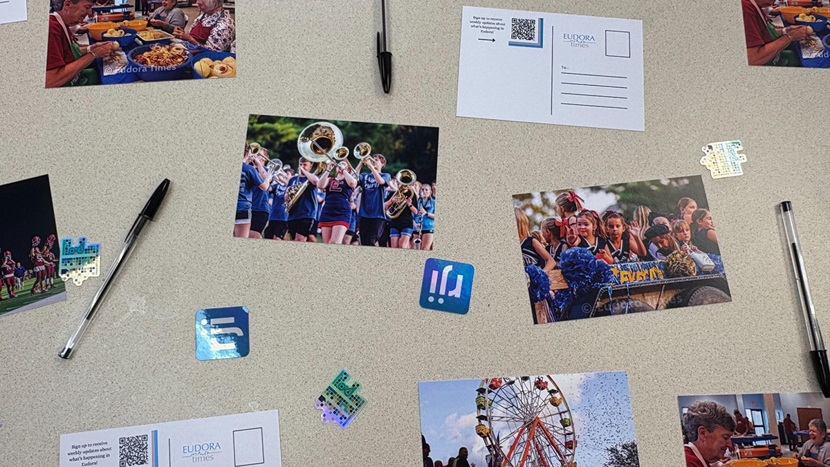 The Innovation in Focus team distributed five different postcards showing Eudora community life at a photo gallery event on March 23.