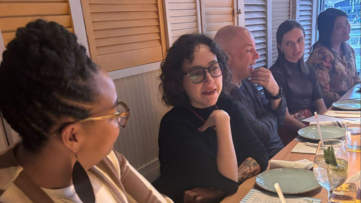 People gathered around a dinner table