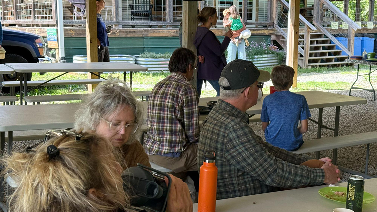 A group of people gathered under a pavilion